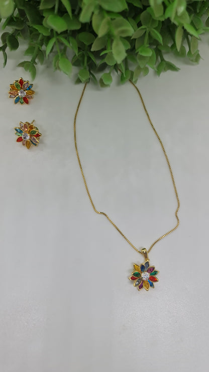 Set collar con dije de flor multicolor en punta dorada/plateada + aros