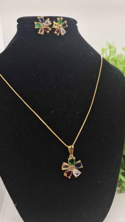 Set de cadena dorada con dije de flor multicolor + aros