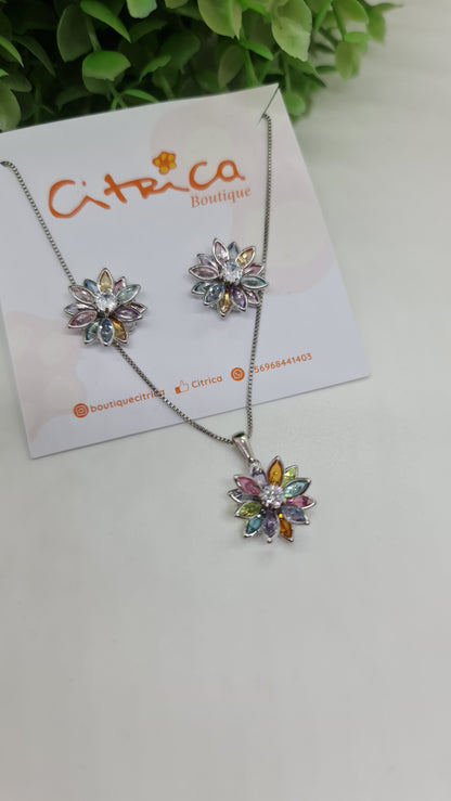 Set collar con dije de flor multicolor en punta dorada/plateada + aros