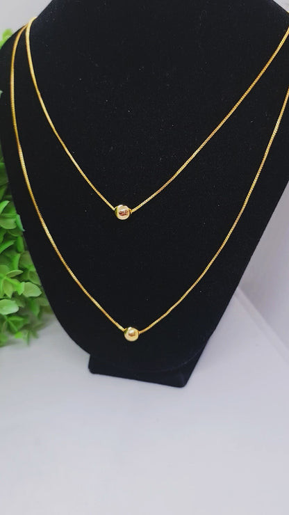 Set cadena doble con dije de esferas + aros